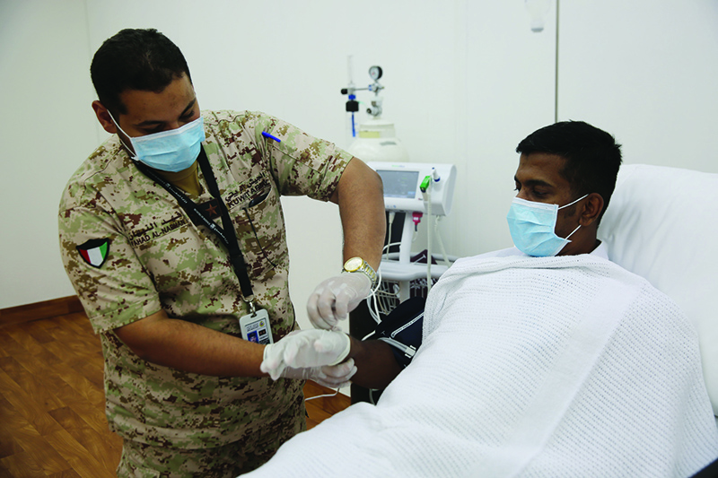 A patient receives medical attention at the Sabhan camp.