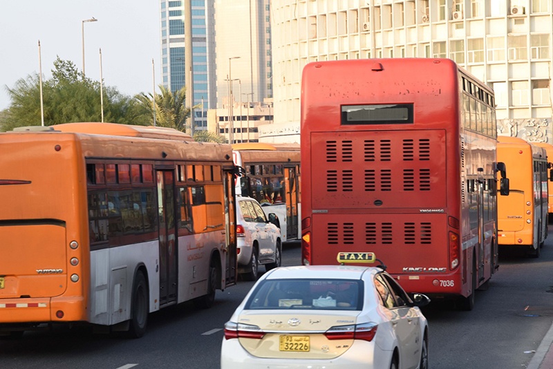 Buses and taxis are seen in Kuwait City in pre-COVID times. – Photo by Fouad Al-Sheikh