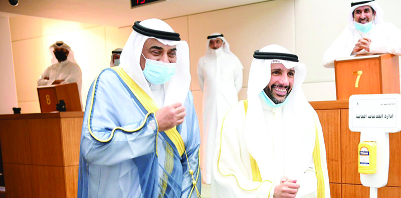 His Highness the Prime Minister Sheikh Sabah Al-Khaled Al-Hamad Al-Sabah (left) and National Assembly Speaker Marzouq Al-Ghanem walk side by side at the end of the session.