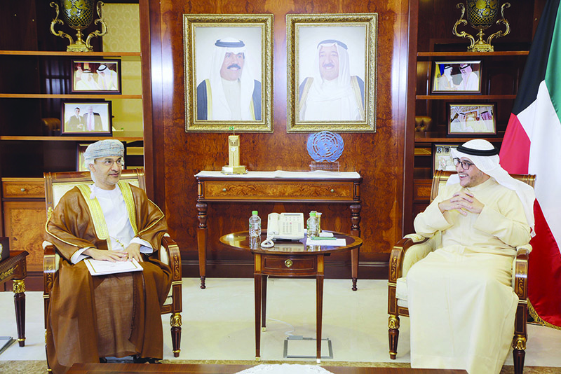 KUWAIT: Kuwaiti Foreign Minister Sheikh Dr Ahmad Nasser Al-Mohammad Al-Sabah meets with Charge d’Affaires of the Omani Embassy in Kuwait Hilal bin Ali Al-Shanfari. — KUNA
