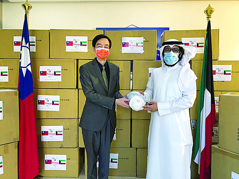 KUWAIT: President of Kuwait Association of Surgeons Dr Salman Al-Sabah receives the equipment from Taiwan Commercial Representative in Kuwait Hua-Wei Mou.