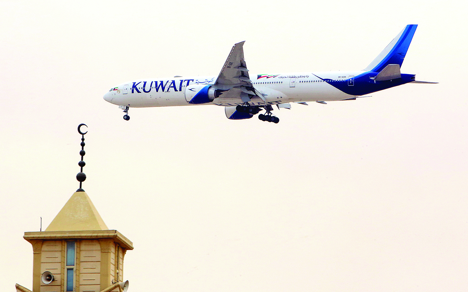 In this file photo, a Kuwait Airways Boeing B777 aircraft prepares to land at Kuwait International Airport in Kuwait City. — Photo by Yasser Al-Zayyat