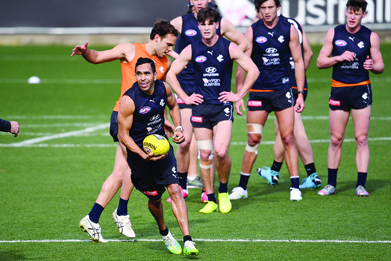 MELBOURNE: Carlton Aussie Rules player Eddie Betts (2/L) trains with teammates in Melbourne yesterday. Australian Rules teams came together to take a knee in support of the “Black Lives Matter” movement, but ongoing racist attacks show there’s still work to do. This month veteran Eddie Betts, in his 16th season, was depicted as a monkey in a Twitter post on the very weekend all teams united in support of Black Lives Matter. — AFP