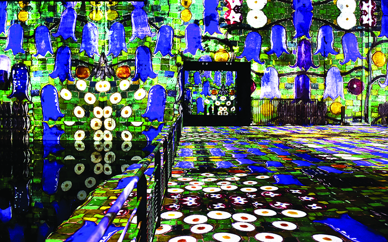 Works by Austrian artist Gustav Klimt are projected on June 3, 2020 in Bordeaux at the “Bassins de Lumieres” digital art center as part of one of the center’s opening exhibitions entitled “Gustav Klimt: gold and colour”. Located in Bordeaux’s former submarine base, the Bassins de Lumières will present monumental immersive digital exhibitions devoted to the major artists in the history of art and contemporary art.—AFP