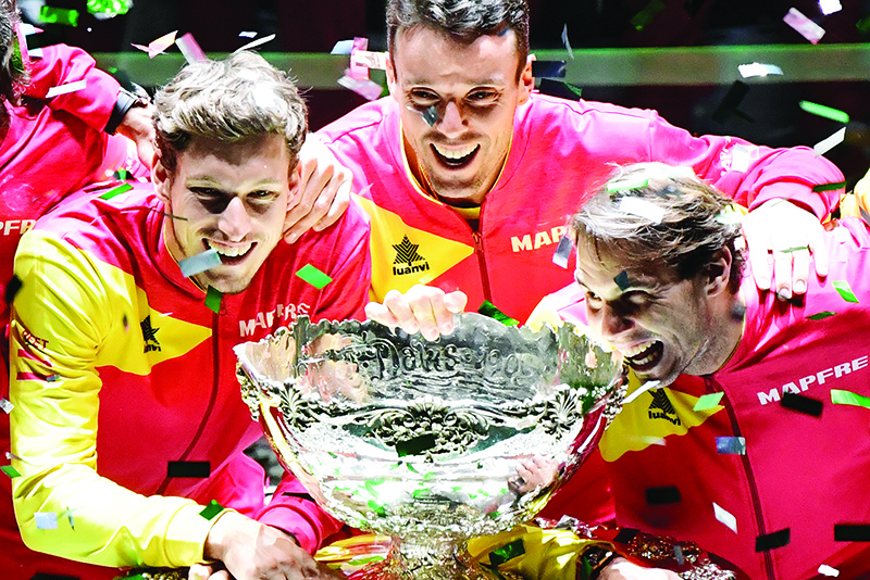 MADRID: File photograph taken on November 24, 2019, (L/R) Spain’s Pablo Carreno, Spain’s Roberto Bautista Agut and Spain’s Rafael Nadal pose with the trophy after winning the final tennis match between Canada and Spain at The Davis Cup Madrid Finals 2019 in Madrid. The Davis Cup finals due to take place in Madrid at the end of November were postponed on June 26, 2020, until 2021 because of the coronavirus pandemic, the ITF announced. — AFP