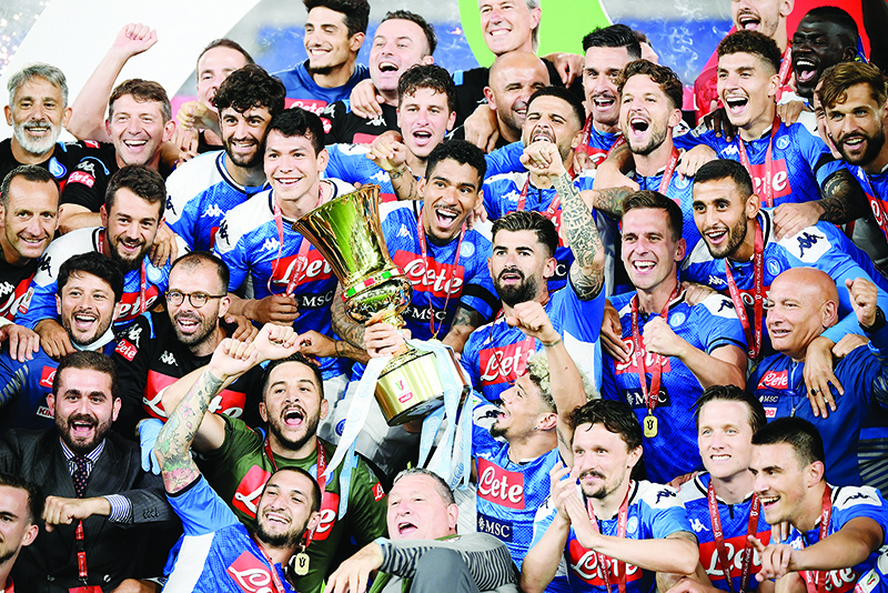 ROME: Napoli’s players and staff celebrate after winning the TIM Italian Cup (Coppa Italia) final football match Napoli vs Juventus on June 17, 2020 at the Olympic stadium in Rome. — AFP