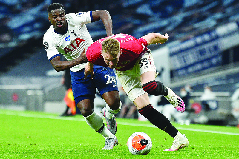 LONDON: Tottenham Hotspur’s Ivorian defender Serge Aurier (L) vies with Manchester United’s Scottish midfielder Scott McTominay (R) during the English Premier League football match between Tottenham Hotspur and Manchester United at Tottenham Hotspur Stadium in London. —AFP