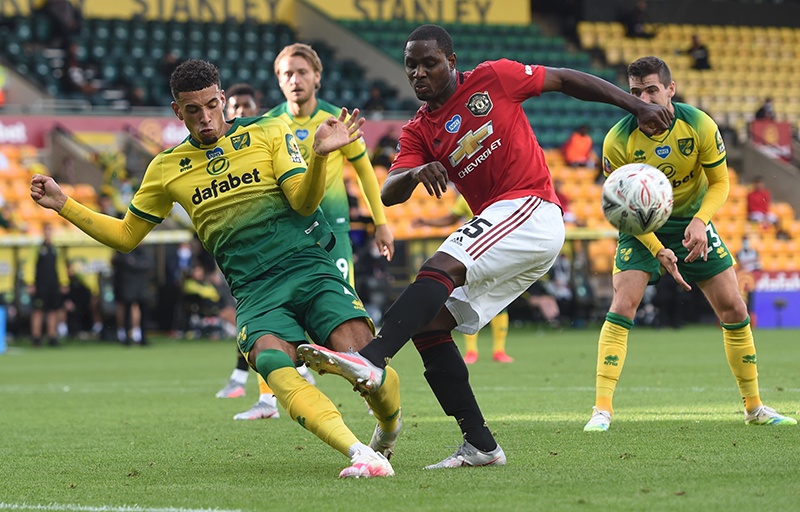 LONDON: Norwich City’s English-born Northern Irish defender Jamal Lewis (L) clocks a shot from Manchester United’s Nigerian striker Odion Ighalo during the English FA Cup quarter-final football match between Norwich City and Manchester United at Carrow Road in Norwich. — AFP