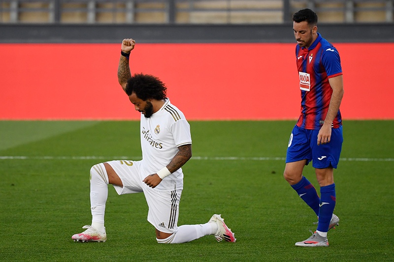 VALDEBEBAS: Real Madrid’s Brazilian defender Marcelo kneels on the field to celebrate his goal during the Spanish League football match between Real Madrid CF and SD Eibar at the Alfredo di Stefano stadium in Valdebebas, on the outskirts of Madrid. — AFP