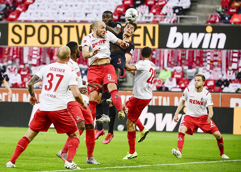 COLOGNE: Cologne’s German defender Rafael Czichos, Leipzig’s French defender Dayot Upamecano and Leipzig’s Czech forward Patrik Schick vie for the ball during the German first division Bundesliga football match FC Cologne vs RB Leipzig, in Cologne on June 1, 2020. —AFP
