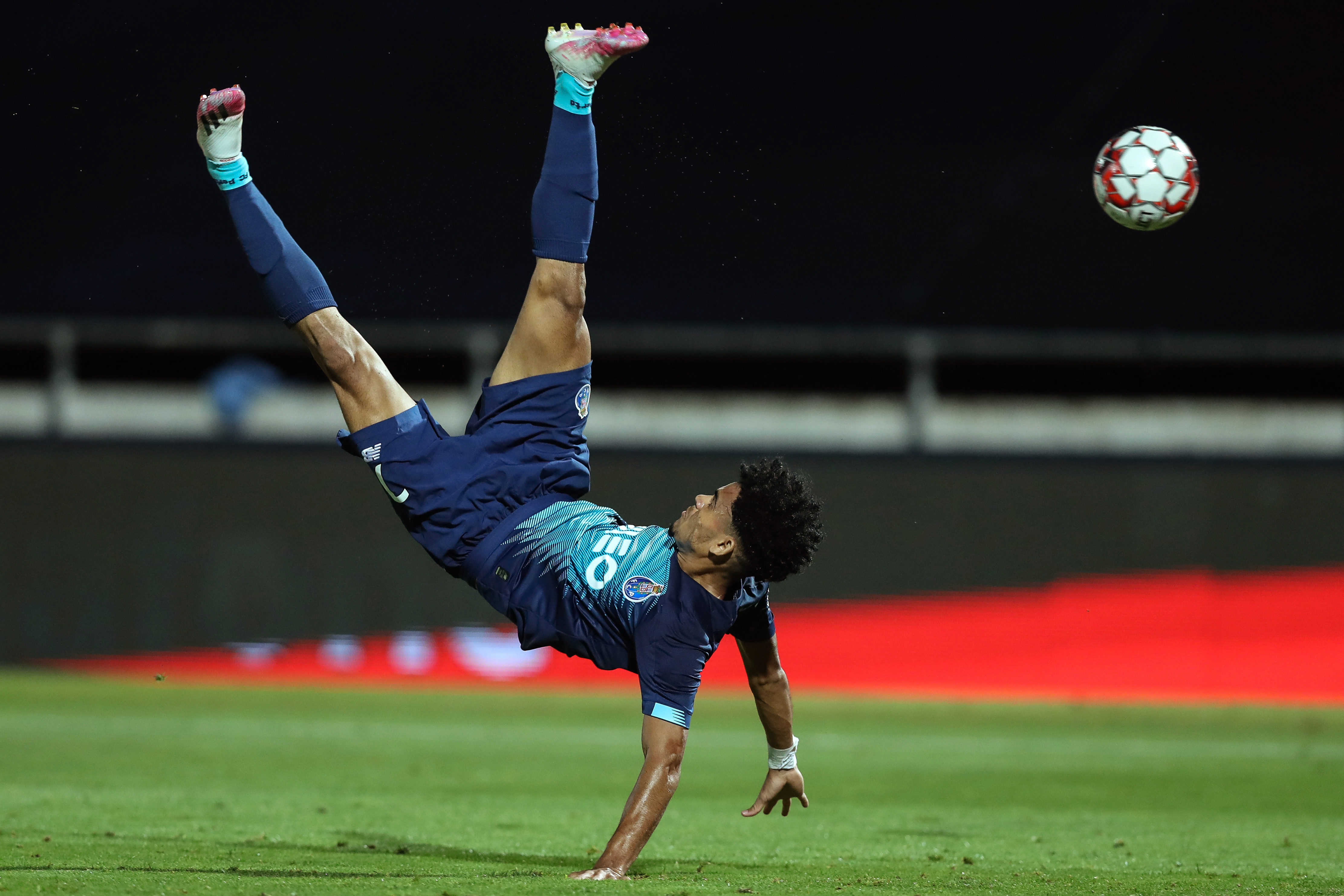 FC Porto's Colombian forward Luis Diaz jumps for the ball during the Portuguese league football match FC Famalicao against FC Porto at the Municipal Stadium in Vila Nova de Famalicao on June 03, 2020. (Photo by Jose COELHO / POOL / AFP)