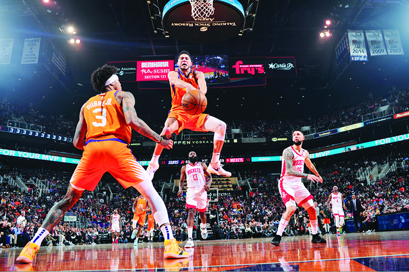 PHOENIX:  File photo shows, Devin Booker #1 of the Phoenix Suns drives to the basket against the Houston Rockets on February 07, 2020 at Talking Stick Resort Arena in Phoenix, Arizona. —AFP