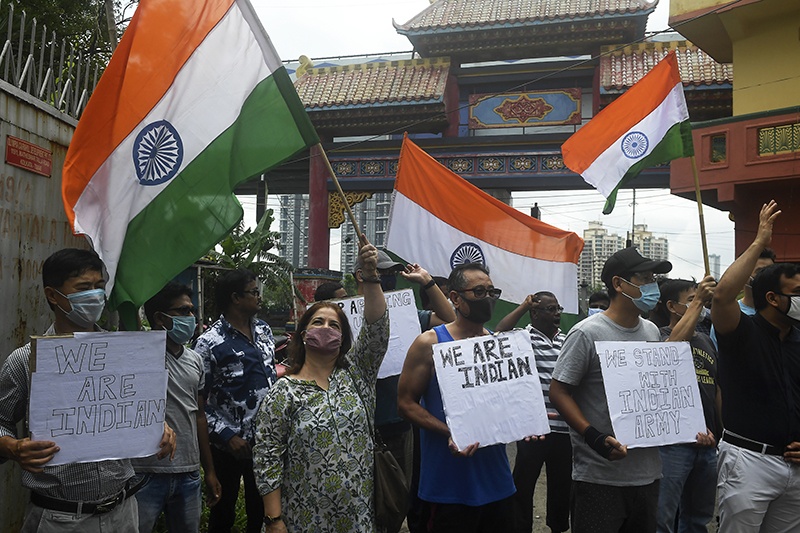 KOLKATA: Indian citizens of Chinese origin holding placards and Indian flags shout slogans in support of the Indian army during an anti-China demonstration in Kolkata’s Chinatown on Saturday. —AFP