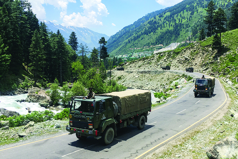 GAGANGIR, India: An Indian army convoy makes its way towards Leh, bordering China, yesterday. — AFP