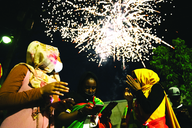 ST PAUL, MN - JULY 04: Members of the Oromo community watch fireworks as they gather to celebrate the life of musician and revolutionary Hachalu Hundessa at the Oromo Community Center on July 4, 2020 in St. Paul, Minnesota. Community artists, musicians, and creatives came together in celebration of Hachalu Hundessas life. Hundessa was murdered in Ethiopia on June 29, 2020. His death has sparked ongoing protests around the world.   Brandon Bell/Getty Images/AFPn== FOR NEWSPAPERS, INTERNET, TELCOS &amp; TELEVISION USE ONLY ==