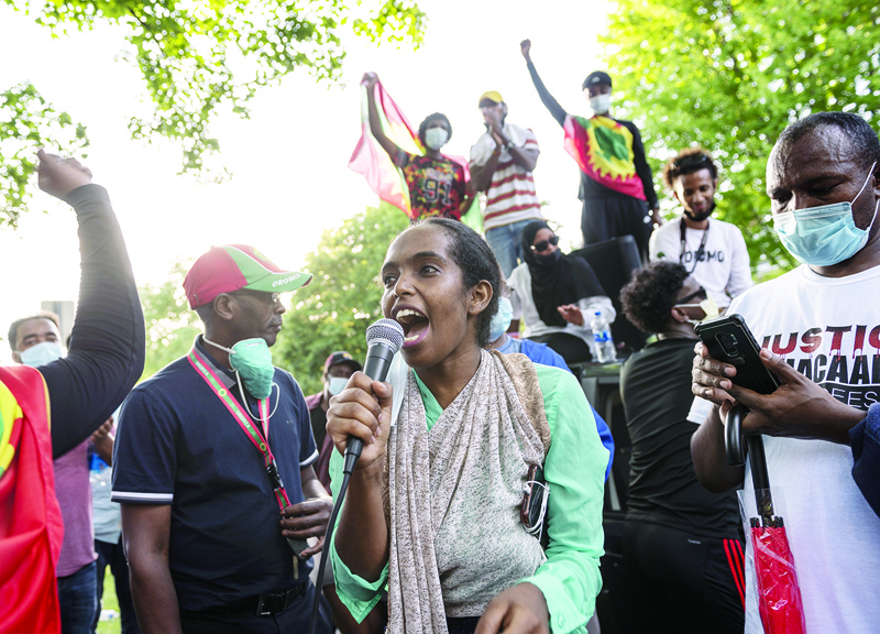 ST PAUL, MN - JUNE 30: Mawardi Moussa speaks to a crowd gathered to protest the death of musician and activist Hachalu Hundessa outside the Governor's Mansion on June 30, 2020 in St Paul, Minnesota. Hundessa, was shot and killed in Addis Ababa, Ethiopia on June 29. He was known for his protest songs which resonated within the Oromo ethnic group.   Stephen Maturen/Getty Images/AFP