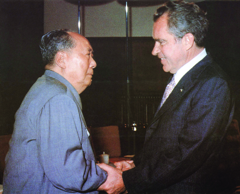 (FILES) In this file photo former Chinese communist leader Chairman Mao Zedong (L) welcomes former US President Richard Nixon at his house in the Forbidden City in Beijing on February 22, 1972. - For half a century, Richard Nixon's opening to communist China has been viewed by many Americans as a diplomatic masterstroke, with successive presidents of both parties following his course. US hawks have now revived an alternative view -- that normalization was a mistake that, in the view of Secretary of State Mike Pompeo, set the stage for an aggressive China and soaring tensions between Washington and Beijing.It all began in 1971 with secret trips to Beijing by Henry Kissinger, Nixon's national security advisor. (Photo by Handout / XINHUA / AFP)