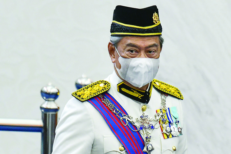 KUALA LUMPUR: In this file handout photo, Malaysia’s Prime Minister Muhyiddin Yassin wears a face mask during the opening ceremony of the third term of the 14th parliamentary session in Kuala Lumpur. Malaysia’s prime minister narrowly won a vote to remove the parliament speaker during a rowdy session of the legislature July 13, a key test of support for the embattled leader. — AFP