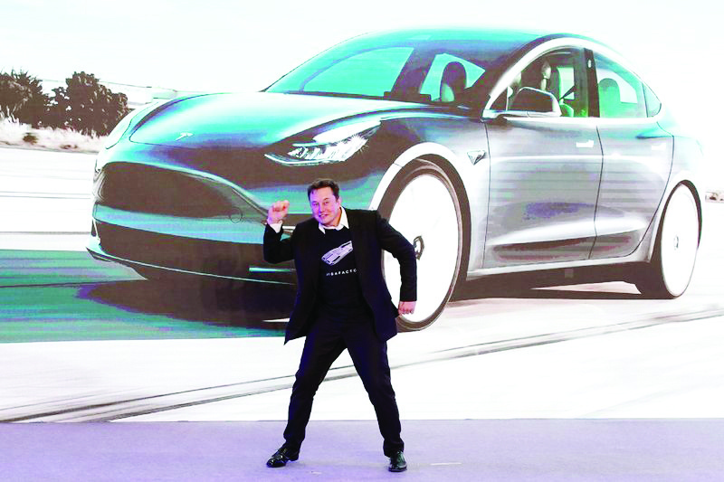 SHANGHAI: Tesla Inc CEO Elon Musk dances onstage during a delivery event for Tesla China-made Model 3 cars in Shanghai. — Reuters