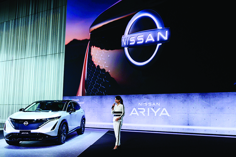 A staff member gives a presentation in the showroom at Nissan's global headquarters in Yokohama on July 28, 2020. - The Japanese auto maker was expected to announce the company's first quarter earnings results later in the day. (Photo by Philip FONG / AFP)