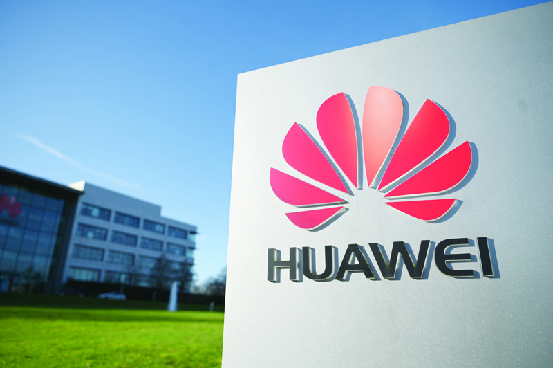 (FILES) In this file photo taken on January 28, 2020 the logo of Chinese company Huawei is seen at their main UK offices in Reading, west of London. - British Prime Minister Boris Johnson will reportedly decide this week whether to phase out the Chinese technology giant's equipment from the UK's 5G network because of persistent spying concerns. (Photo by DANIEL LEAL-OLIVAS / AFP)