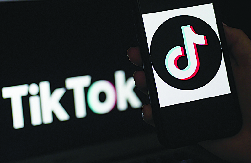 The social media application logo TikTok is displayed on the screen of an iPhone, in Arlington, Virginia. —AFP