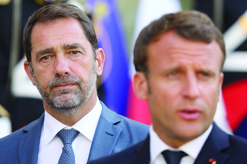 PARIS: In this file photo, French Interior Minister Christophe Castaner (left) listens to French President Emmanuel Macron after a meeting at the Elysee presidential Palace. French Interior Minister Christophe Castaner leaves the French Government following a reshuffle by newly nominated Prime Minister. — AFP