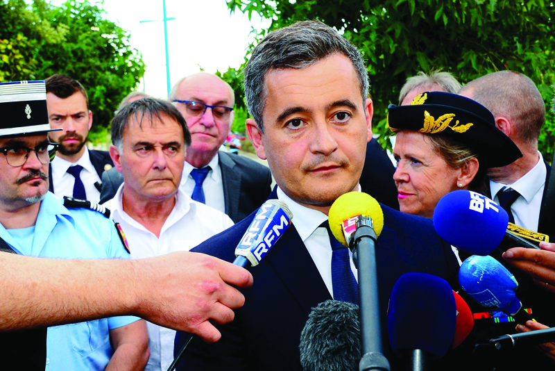 French Interior Minister Gerald Darmanin (C) answers journalists' questions as he visits the Gendarmerie of Port-Sainte-Marie near Agen, on July 7, 2020, to pay tribute in Gendarme Melanie Lemee who was fatally hit by a car at a military checkpoint on the D813 road on July 4. (Photo by MEHDI FEDOUACH / POOL / AFP)