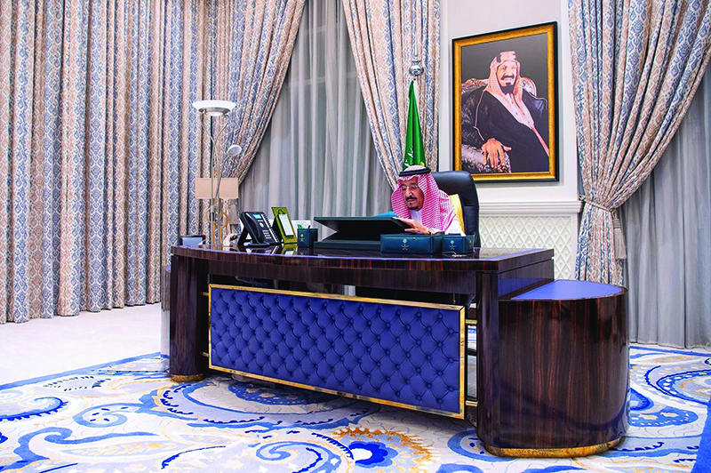 RIYADH: A handout picture provided yesterday shows King Salman bin Abdulaziz chairing a virtual cabinet meeting from his office at the King Faisal Specialist Hospital late Tuesday. — AFP