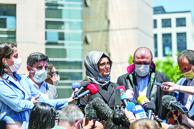 ISTANBUL: Hatice Cengiz (center), Jamal Khashoggi’s fiancee, speaks to the press as she leaves the Istanbul courthouse on July 3, 2020 after attending the trial of 20 Saudi suspects accused of killing and dismembering her fiance in 2018. — AFP