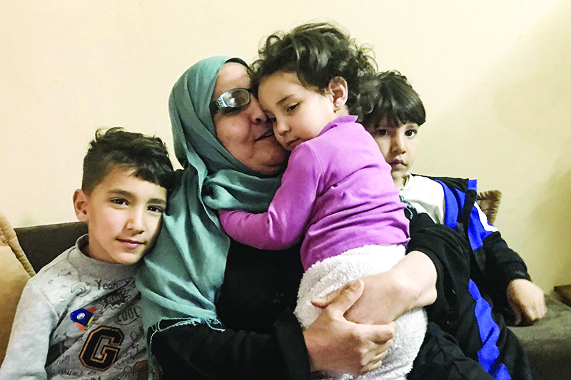 KAIROUAN, Tunisia: Taheyya, a grandmother from the Tunisian city of Kairouan, about 160 kilometers south of the capital Tunis, is pictured with her grandchildren whose uncle was killed in Syria.