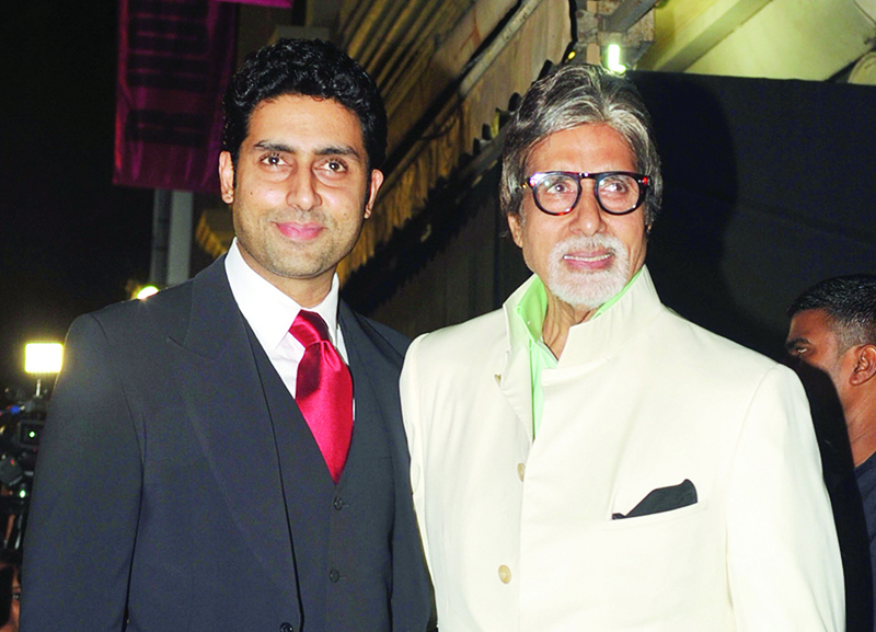 In this file photo taken on January 12, 2013 Bollywood actors Amitabh Bachchan (right) and his son Abhishek Bachchan pose during the inauguration of a furniture showroom by actors Sunil and Mana Shetty in Mumbai. —AFP
