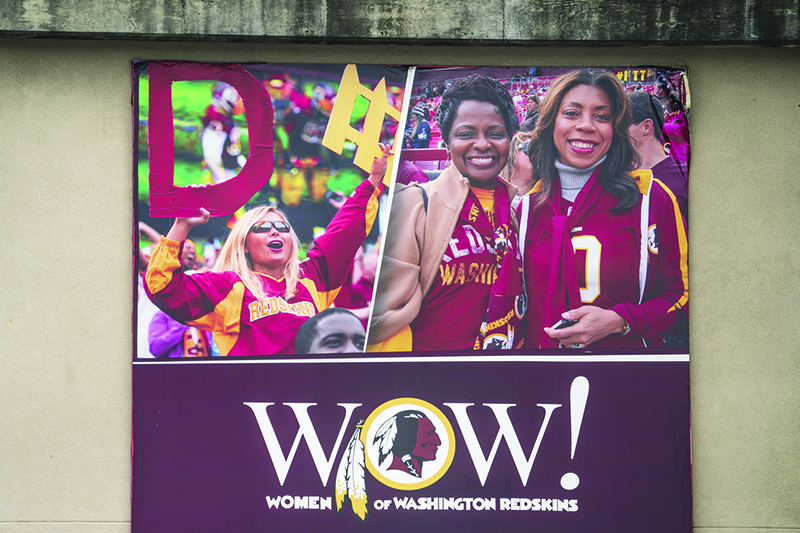 LANDOVER:  An advertisement for “Women of Washington Redskins” is seen on the outside of FedEx Field on July 7, 2020 in Landover, Maryland. After receiving recent pressure from sponsors and retailers, the NFL franchise is considering a name change to replace Redskins. The term “redskin” is a dictionary-defined racial slur for Native Americans. —AFP
