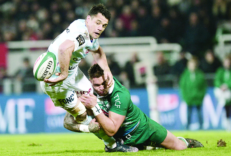 PAU: File photograph taken on February 24, 2018, Racing 92’s New Zealander fly-half Dan Carter (L) passes the ball during the French Top 14 rugby union match between Pau and Racing 92 at The Hameau Stadium in Pau, south-western France. In early July 2020 it was announced that from 2021 the salary cap, will gradually drop to 9,94 million euros in the following years due to the financial impact of the coronavirus pandemic. —AFP