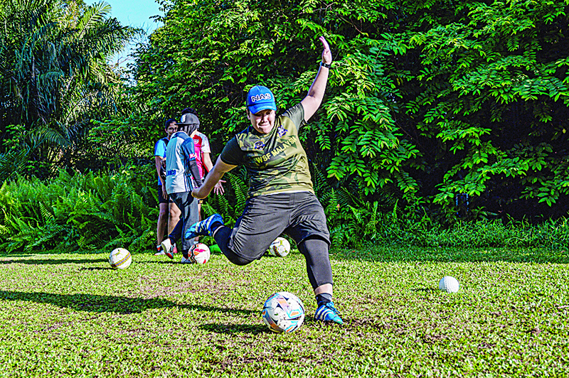 SHAH ALAM: This picture taken on June 21, 2020 shows Jamiatul Akmal Abdul Jabar, 38, kicking the ball on a footgolf course in Shah Alam, on the outskirts of Kuala Lumpur. Footgolf, a novel fusion of two of the world’s most popular sports, is growing fast and attracting young people back on to the fairways.  —AFP