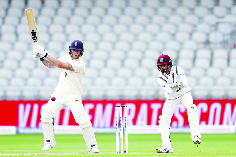 MANCHESTER: England’s Ben Stokes plays a shot as West Indies’ Shane Dowrich (R) keeps wicket during play on the second day of the second Test cricket match between England and the West Indies at Old Trafford in Manchester, north-west England on July 17, 2020.  — AFP
