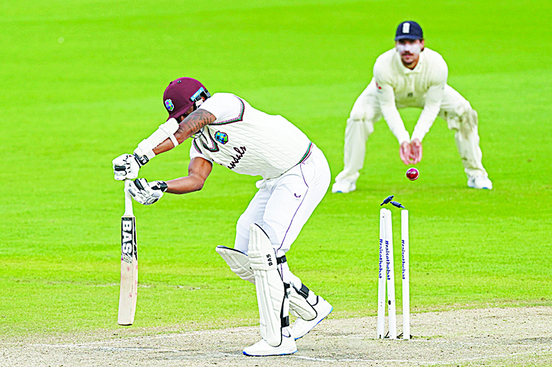 MANCHESTER: West Indies’ Shannon Gabriel is bowled by England’s Chris Woakes on the fourth day of the second Test cricket match between England and the West Indies at Old Trafford in Manchester, northwest England. —AFP
