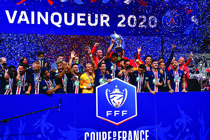 PARIS: Paris Saint-Germain’s players celebrate with the trophy after winning the French Cup final football match between Paris Saint-Germain (PSG) and Saint-Etienne (ASSE) on July 24, 2020, at the Stade de France in Saint-Denis, outside Paris. — AFP