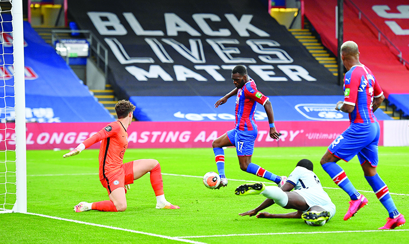 LONDON: Crystal Palace’s Zaire-born Belgian striker Christian Benteke (C) scores their second goal during the English Premier League football match between Crystal Palace and Chelsea at Selhurst Park in south London. — AFP