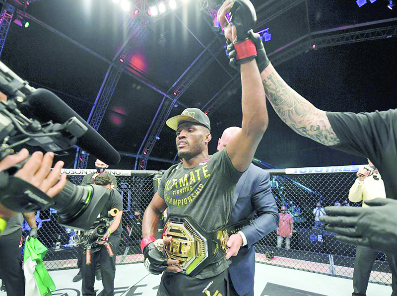 YAS ISLAND: Kamaru Usman of Nigeria celebrates after his victory over Jorge Masvidal in their UFC welterweight championship fight during the UFC 251 event at Flash Forum on UFC Fight Island on Yas Island in Abu Dhabi. — AFP