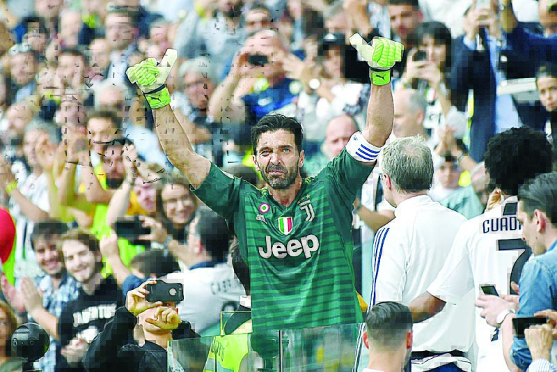 (FILES) In this file photo taken on May 19, 2018 Juventus' goalkeeper from Italy Gianluigi Buffon reacts as he leaves the pitch for his last game with Juventus team during the Italian Serie A football match Juventus versus Verona, at the Allianz Stadium in Turin. - The legendary Italian goalkeeper Gianluigi Buffon should become on July 4, 2020 the sole holder of the record for the number of games played in Serie A with 648 appointment with Italian football team Juventus. (Photo by MARCO BERTORELLO / AFP)