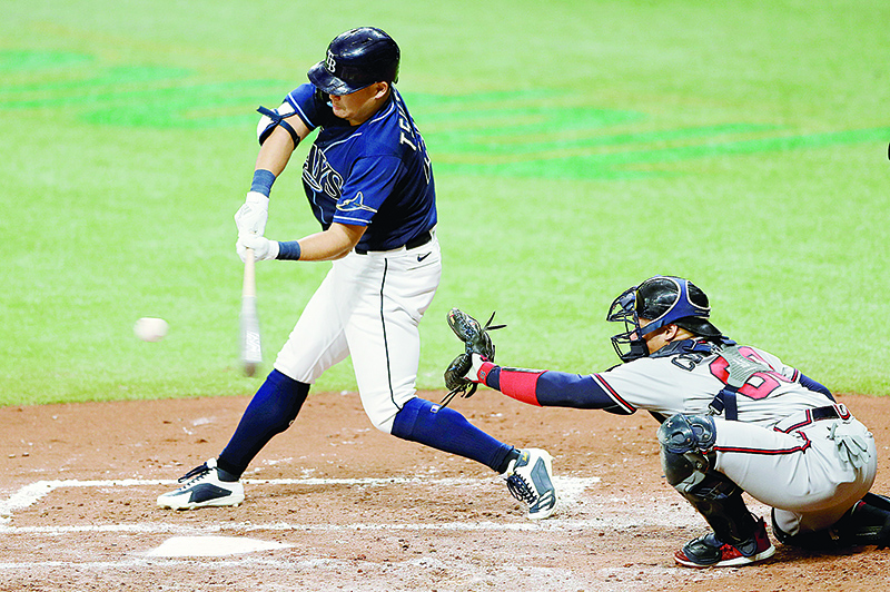 ST PETERSBURG: Yoshitomo Tsutsugo #25 of the Tampa Bay Rays hits in the second inning during a game against the Atlanta Braves at Tropicana Field in St Petersburg, Florida. - AFP