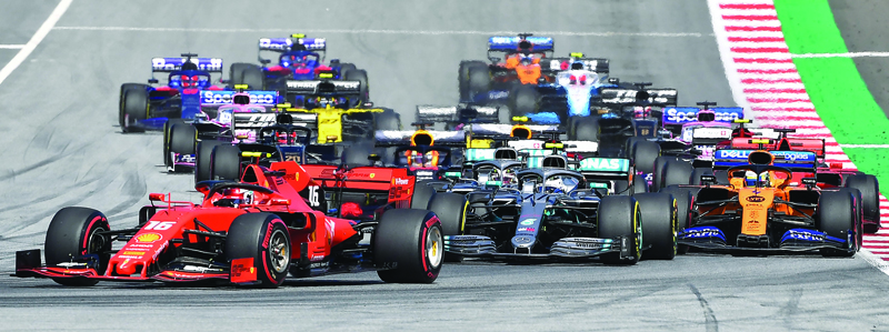 (FILES) In this file photo taken on June 30, 2019 Ferrari's Monegasque driver Charles Leclerc leads at the start of the Austrian Formula One Grand Prix in Spielberg. - Seven months after they last competed in earnest, the Formula One circus will push a post-lockdown ëre-setí button to open the 2020 season in Austria on July 4. (Photo by JOE KLAMAR / AFP)
