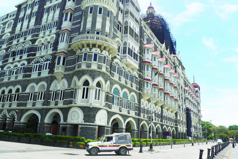 A police vehicle is seen parked outside the Taj Mahal Hotel in Mumbai on June 30, 2020 following threat calls from Pakistan to two Taj hotels, local media reported. (Photo by Punit PARANJPE / AFP)