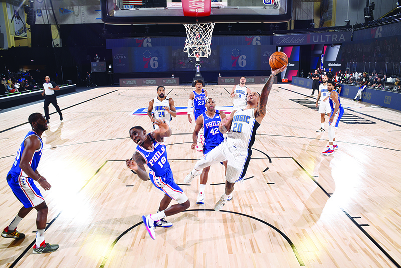 ORLANDO: Markelle Fultz #20 of the Orlando Magic drives to the basket during the game against the Philadelphia 76ers on August 7, 2020 at The HP Field House at ESPN Wide World Of Sports Complex in Orlando, Florida. — AFP