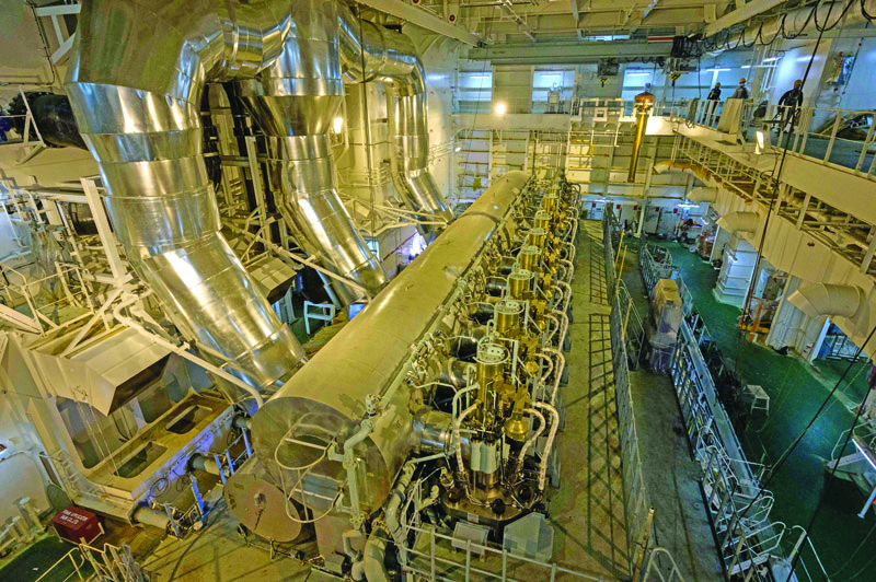 This photo taken on August 11, 2020 shows a general view of the engine room of the HMM St Petersburg, during a media tour in which access and photography was restricted, at the Samsung/DSME shipyard in Geoje, near Busan. - At 400 metres, the HMM St Petersburg is 100 metres (328 ft.) longer than the Eiffel Tower is tall, and 62 metres (203 ft.) wide. It has a capacity of 23,820 TEU (20-foot equivalent units, the standard measure of a container), which owner Hyundai Merchant Marine (HMM) says can carry seven billion choco-pies, a popular Korean snack -- one for every human being on the planet. (Photo by STR / AFP)