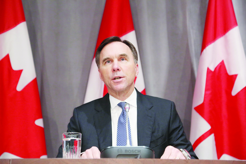 (FILES) In this file photo taken on March 18, 2020 Canada's Finance Minister Bill Morneau speaks during a news conference on Parliament Hill in Ottawa, Ontario. - Canada's finance minister, Bill Morneau, announced his resignation on August 17, 2020, on the heels of an ethics scandal and amid a reported split with Prime Minister Justin Trudeau over pandemic spending. (Photo by Dave Chan / AFP)