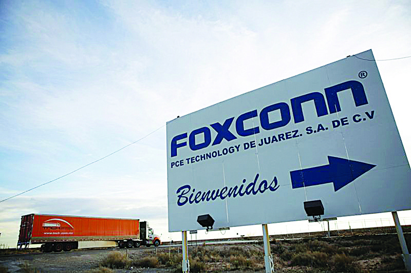 FILE PHOTO: A sign announces the manufacturing complex of Foxconn PCE Technology, in Ciudad Juarez, Mexico February 6, 2020. Picture taken February 6, 2020. REUTERS/Jose Luis Gonzalez/File Photo