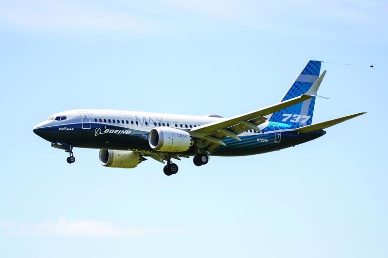 (FILES) In this file photo taken on June 29, 2020 a Boeing 737 MAX jet comes in for a landing following a Federal Aviation Administration (FAA) test flight at Boeing Field in Seattle, Washington. - US durable good orders in June continued their recovery from the COVID-19 hit, with new orders rising 7.3 percent on demand for transportation equipment, the Commerce Department said on July 27, 2020. The $206.9 billion in business done last month followed a surge in new orders in May by a downwardly revised 15.1 percent, after the Detroit automakers and plane maker Boeing restarted production. (Photo by Jason Redmond / AFP)