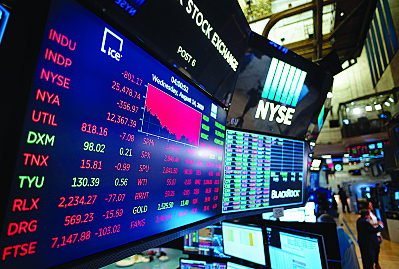(FILES) In this file photo taken on August 14, 2019 A TV screen shows the numbers after the closing bell at the New York Stock Exchange (NYSE) in New York City. - US officials on August 6, 2020 proposed toughening rules for Chinese companies listed on American stock exchanges as recent scandals have prompted concerns about the reliability of some of the firms' documents. (Photo by Johannes EISELE / AFP)